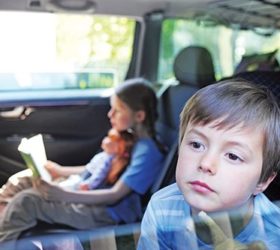 Child Looks Out Of UV Protected Car Window